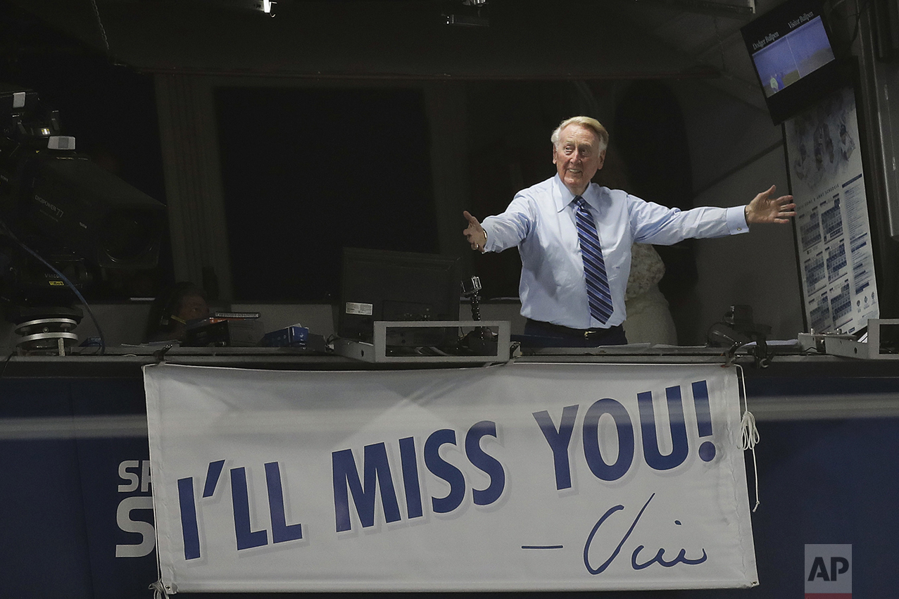  Los Angeles Dodgers broadcaster Vin Scully gestures in his booth during a baseball game between the Los Angeles Dodgers and the Colorado Rockies on Sept. 23, 2016, in Los Angeles. Scully retired in 2016. (AP Photo/Jae C. Hong) 