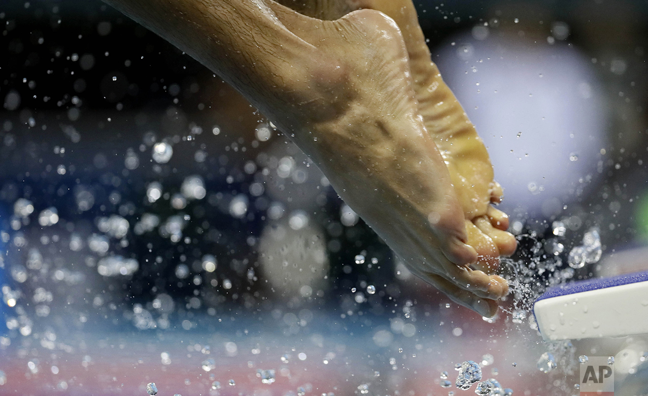  A swimmer enters the pool during a training session prior to the 2016 Summer Olympics on Aug. 4, 2016, in Rio de Janeiro, Brazil. (AP Photo/Matt Slocum) 