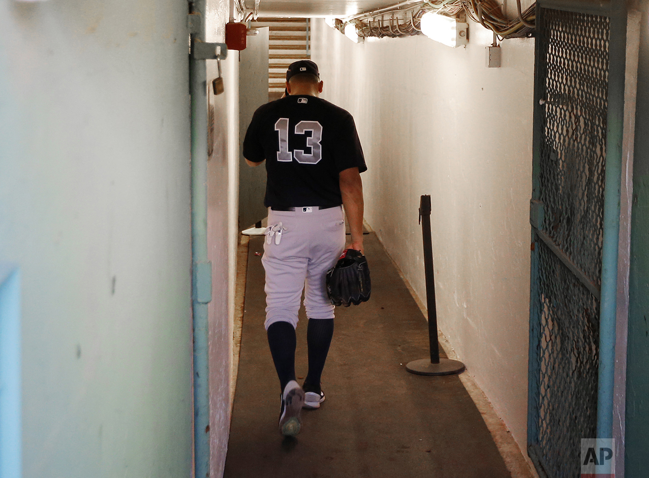  New York Yankees' Alex Rodriguez walks back down the tunnel to the clubhouse before the team's baseball game against the Boston Red Sox at Fenway Park in Boston on Aug. 9, 2016. Rodriguez played his final Major League Baseball game later the same we