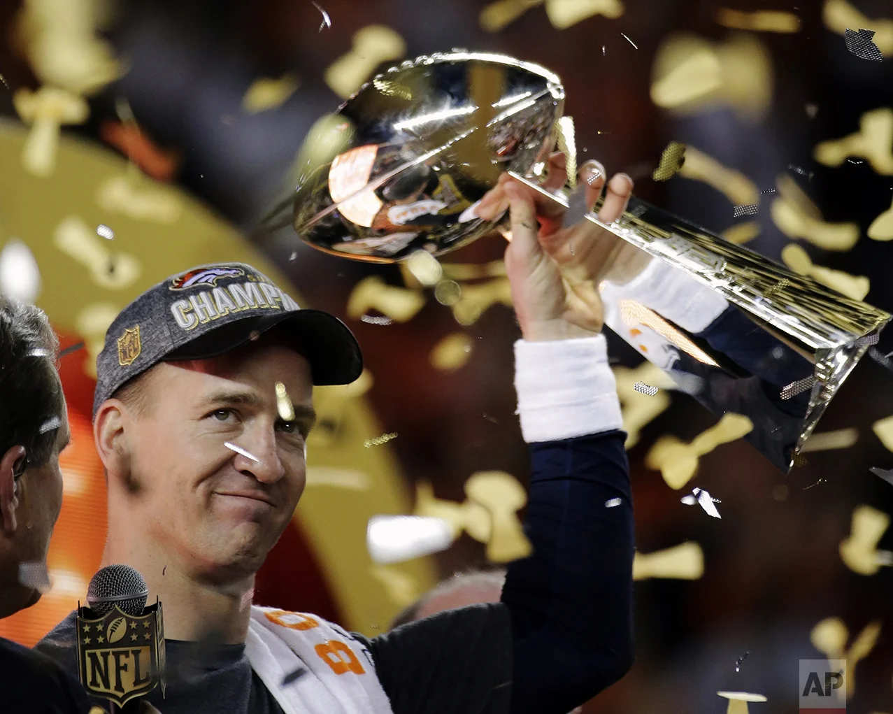 Denver Broncos' Peyton Manning holds up the trophy after the NFL Super Bowl 50 football game on Feb. 7, 2016, in Santa Clara, Calif. The Broncos won 24-10. (AP Photo/Matt York)
