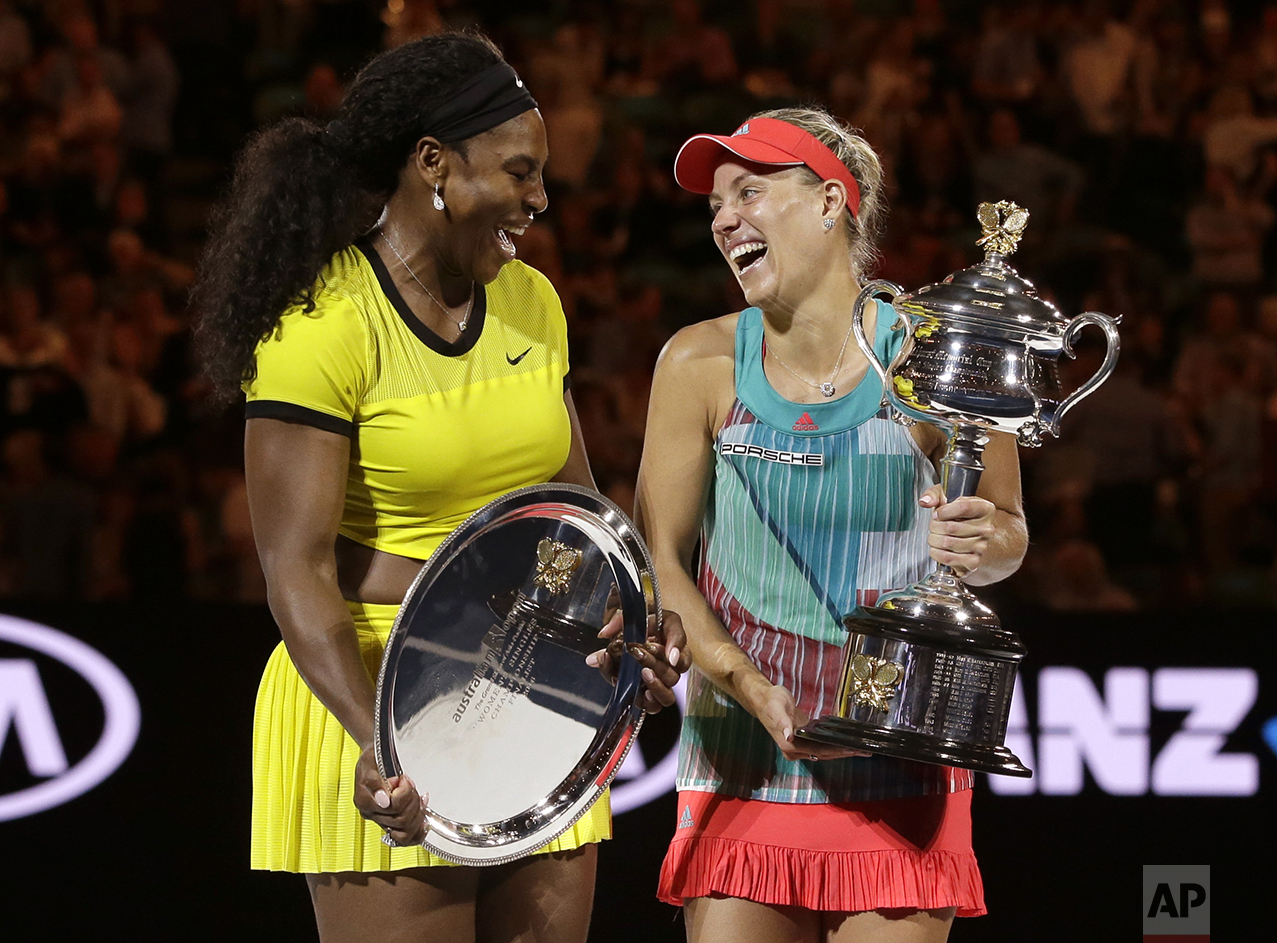  Angelique Kerber, right, of Germany enjoys a joke with runner-up Serena Williams of the United States after winning their women's singles final at the Australian Open tennis championships in Melbourne, Australia, on Jan. 30, 2016. (AP Photo/Aaron Fa