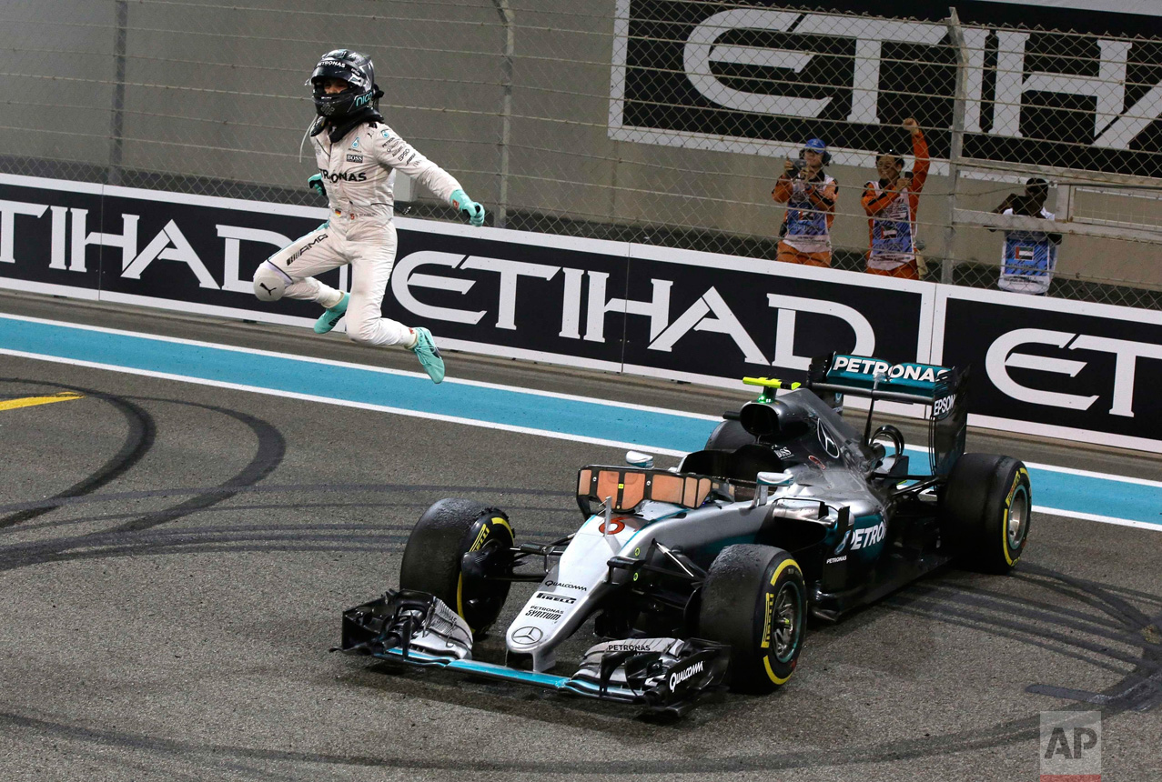  In this Sunday, Nov. 27, 2016 photo, Mercedes F1 driver Nico Rosberg of Germany celebrates after finishing second to win the 2016 world championship during the Emirates Formula One Grand Prix at the Yas Marina racetrack in Abu Dhabi, United Arab Emi