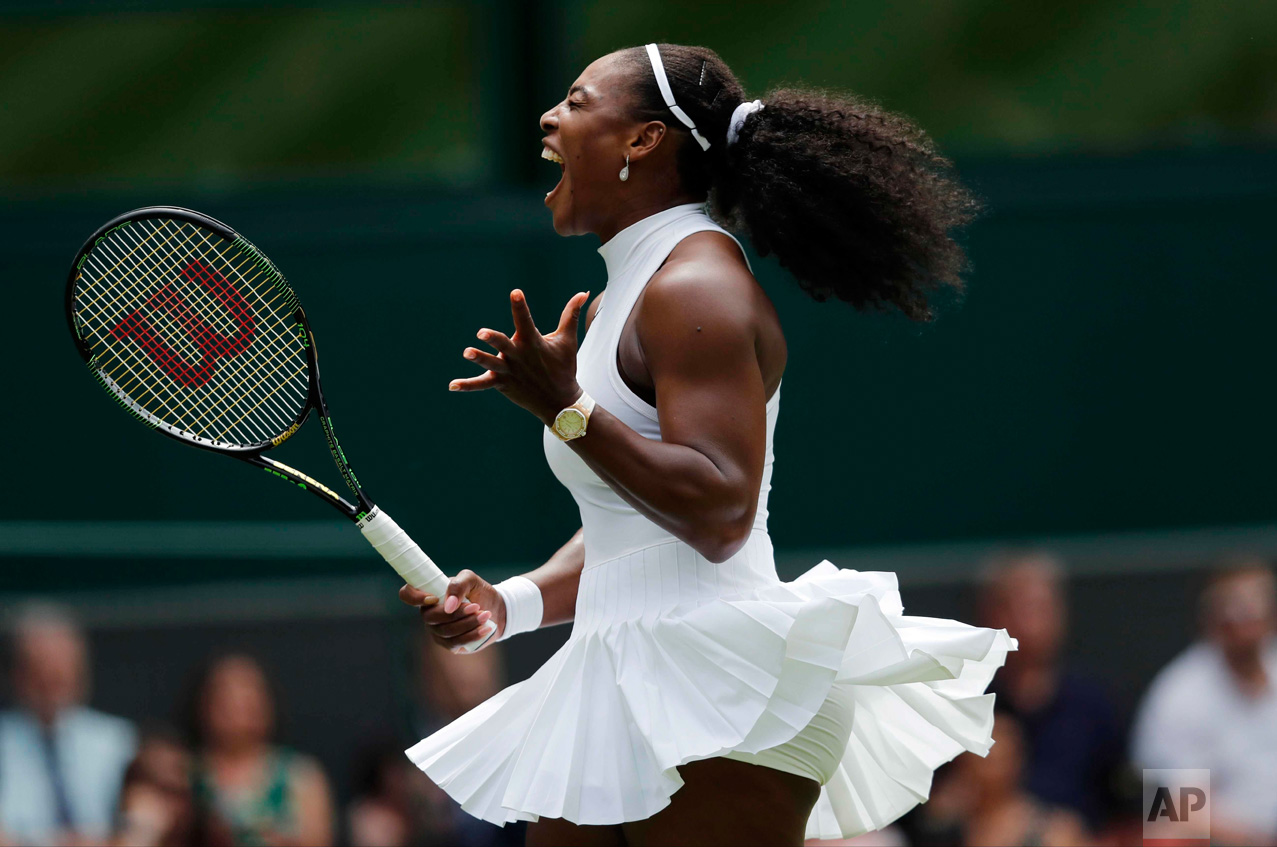  In this Tuesday, June 28, 2016 photo, Serena Williams of the U.S celebrates a point against Amara Safikovic of Switzerland during their women's singles match on day two of the Wimbledon Tennis Championships in London. (AP Photo/Ben Curtis) 