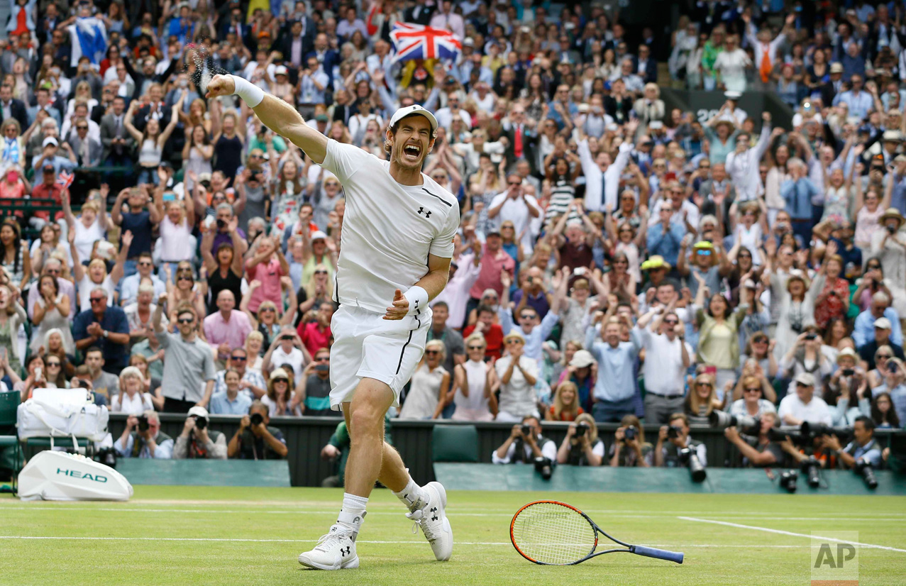  In this Sunday, July 10, 2016 photo, Andy Murray of Britain celebrates after beating Milos Raonic of Canada in the men's singles final on day fourteen of the Wimbledon Tennis Championships in London. (AP Photo/Kirsty Wigglesworth) 