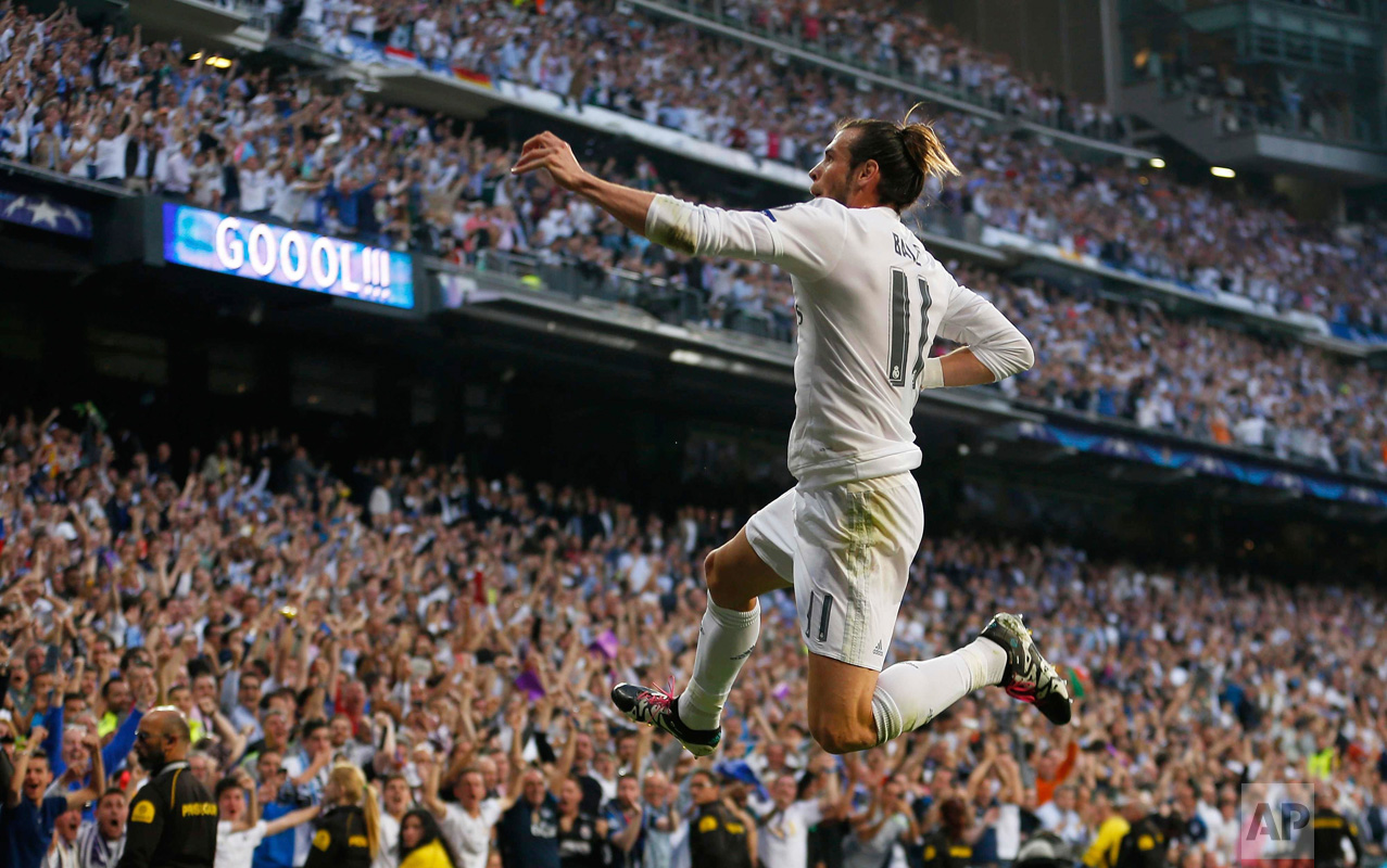  In this Wednesday May 4, 2016 photo, Real Madrid's Gareth Bale celebrates after scoring the opening goal during the Champions League semifinal second leg soccer match between Real Madrid and Manchester City at the Santiago Bernabeu stadium in Madrid