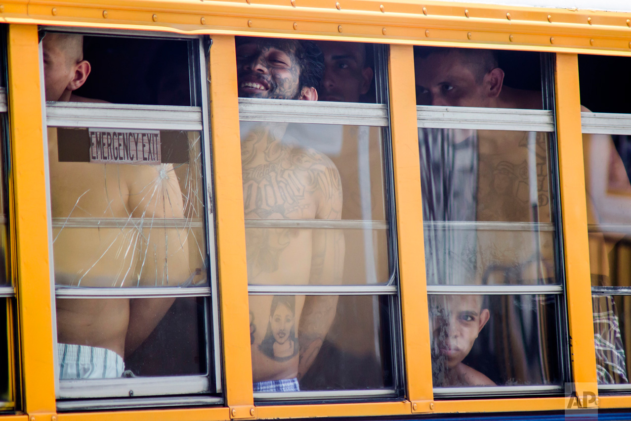  In this June 16, 2016 photo, inmates ride in a bus out of the Cojutepeque prison in El Salvador. This prison, which houses more than a thousand 18th street imprisoned gang members, was closed down by the government, because it was unable to prevent 