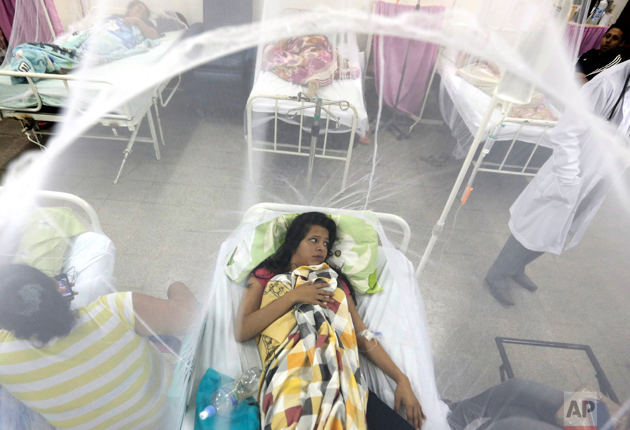  In this Feb. 5, 2016 photo, Nadia Gonzalez protected by a mosquito net, recovers from a bout of dengue fever at a hospital in Luque, Paraguay. (AP Photo/Jorge Saenz) 