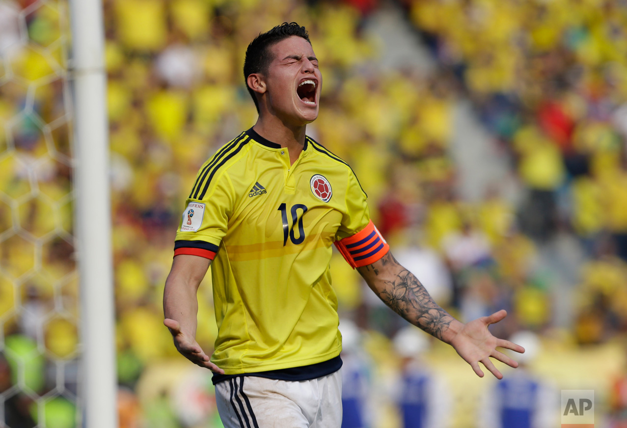  In this March 29, 2016 photo, Colombia's James Rodriguez reacts after missing a chance to score during the 2018 World Cup qualifying soccer match against Ecuador, in Barranquilla, Colombia. Colombia won the match 3-1. (AP Photo/Fernando Vergara) 