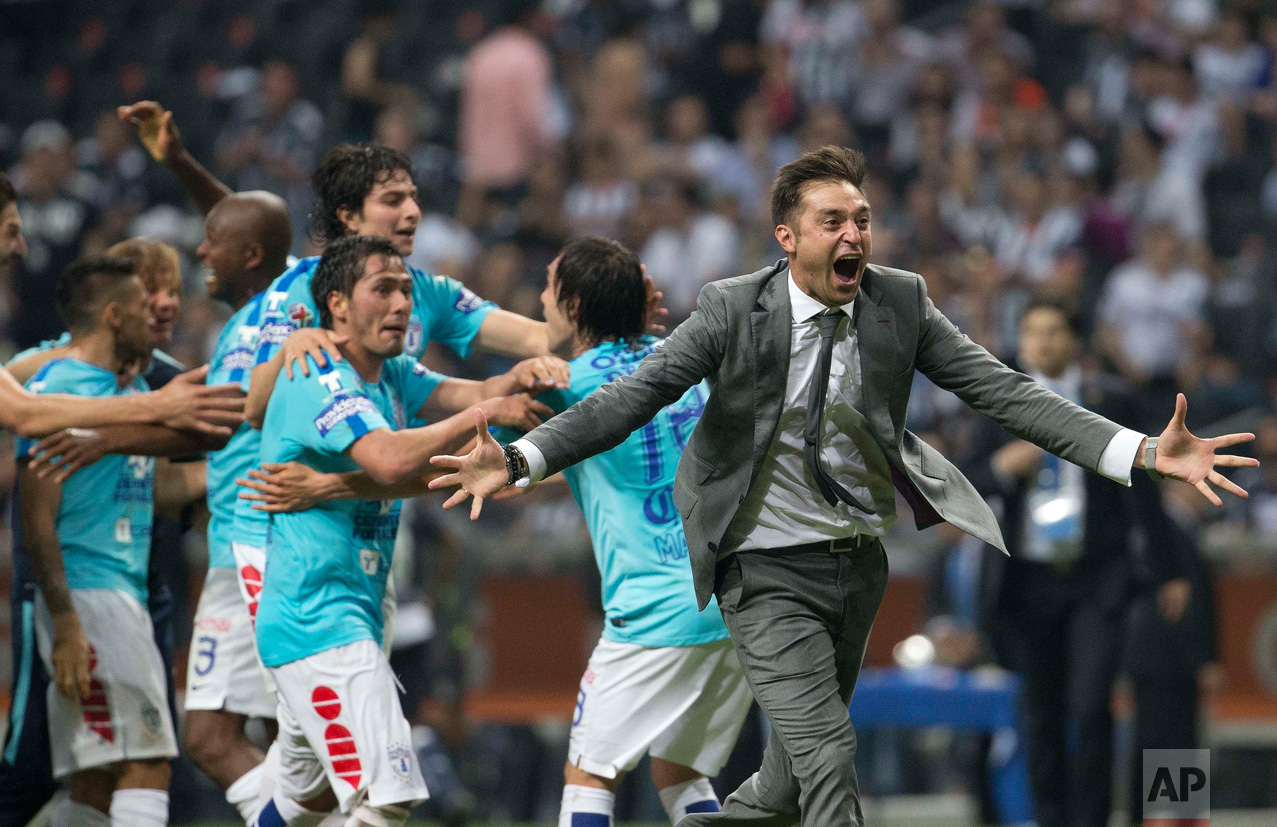  In this May 29, 2016 photo, Pachuca's coach Diego Alonso, right, celebrates after defeating of Monterrey and crowning themselves champions of the Mexican soccer league, in Monterrey. (AP Photo/Eduardo Verdugo) 