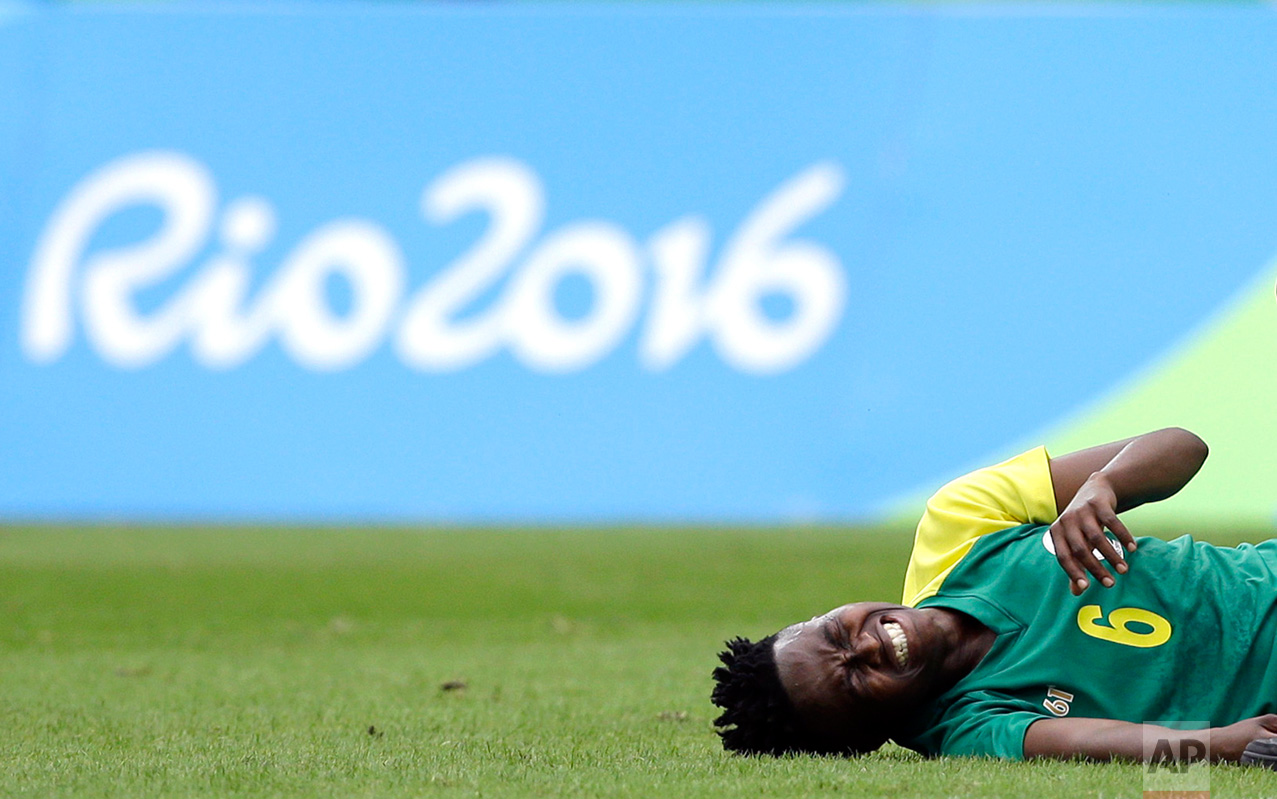  In this Aug. 3, 2016 photo, South Africa's Mamello Makhabane grimaces in pain after being fouled during the opening match of the women's Olympic football tournament between Sweden and South Africa at the Rio Olympic Stadium in Rio de Janeiro, Brazil