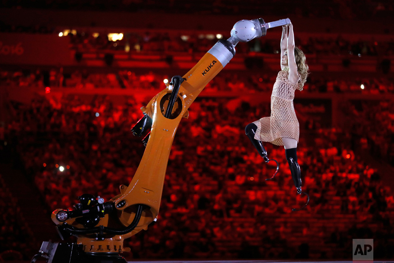  In this Sept. 7, 2016 photo, amputee Amy Purdy dances with a robot during the opening ceremony of the Paralympic Games at Maracana Stadium in Rio de Janeiro, Brazil. (AP Photo/Mauro Pimentel) 