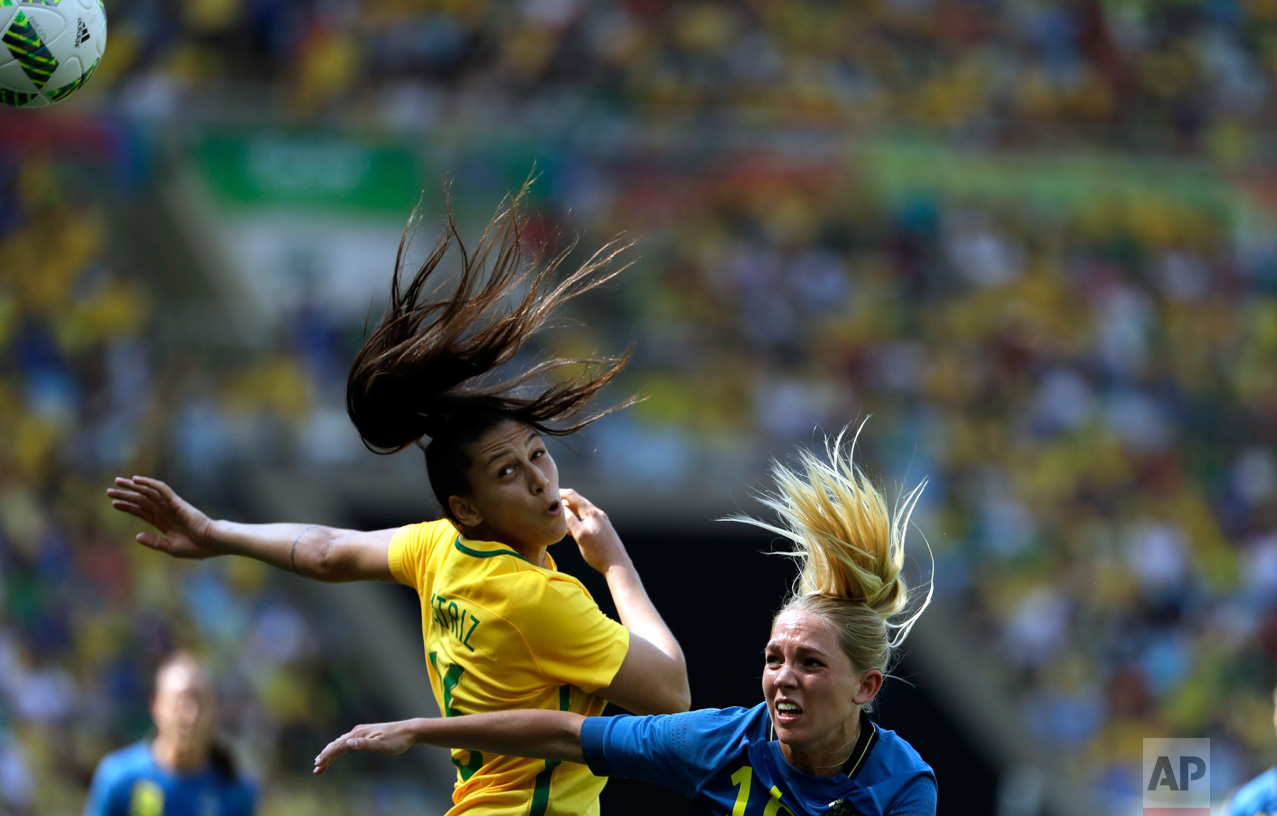  In this Aug. 16, 2016 photo, Brazil's Beatriz, left, and Sweden's Elin Rubensson go for a header during a semi-final match of the women's Olympic football tournament between Brazil and Sweden at the Maracana Stadium in Rio de Janeiro.(AP Photo/Natac