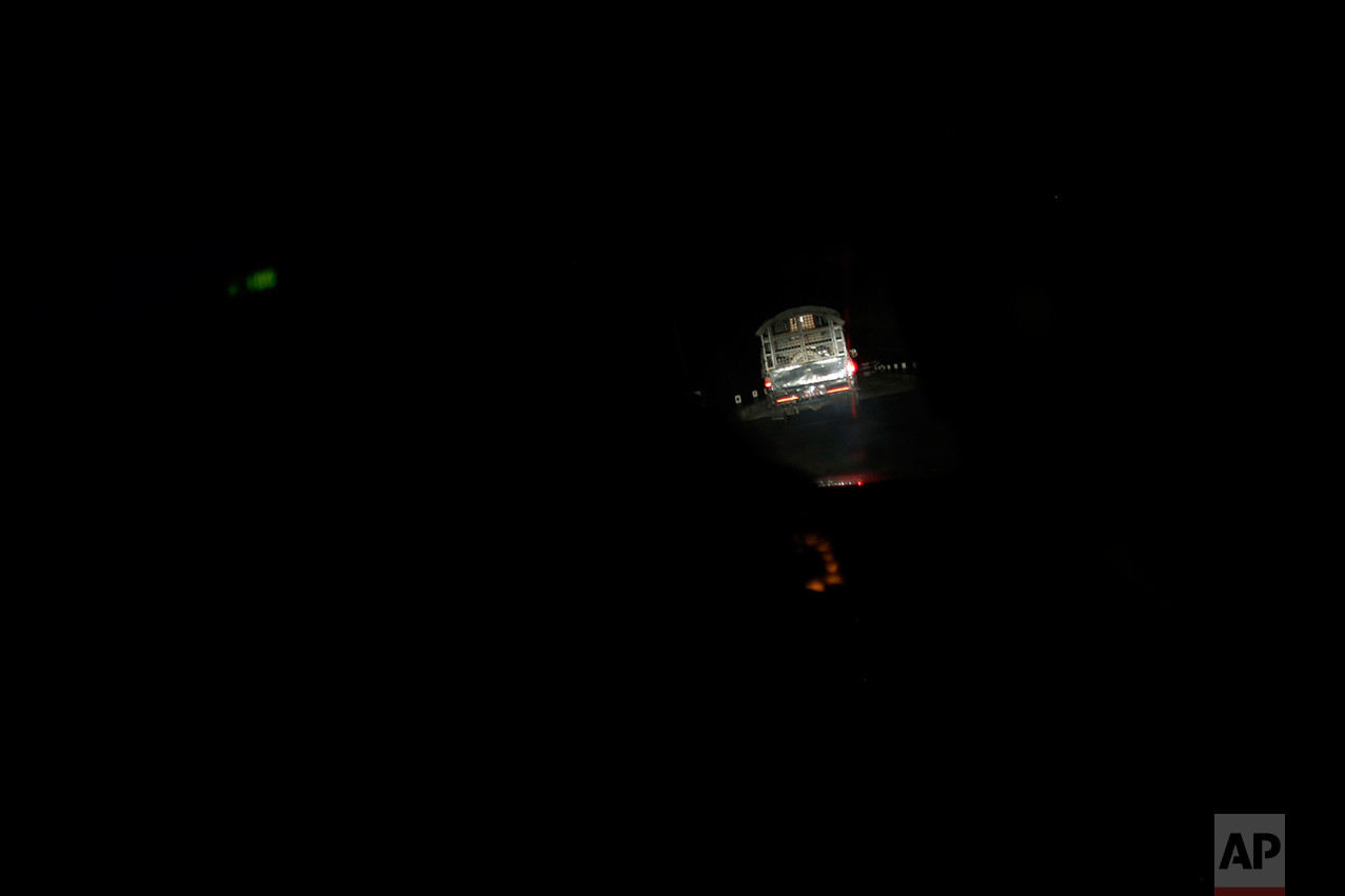 In this Nov. 23, 2016 photo, a truck carrying the coffin of Balkisun Mandal Khatwe travels on a badly rutted road towards his village of Belhi, Saptari district of Nepal. Balkisun, who had been working for Habtoor Leighton Group in Qatar for less than a month, died in his sleep. The number of Nepali workers going abroad has more than doubled since the country began promoting foreign labor in recent years: from about 220,000 in 2008 to about 500,000 in 2015. Yet the number of deaths among those workers has risen much faster in the same period. In total, over 5,000 workers from this small country have died working abroad since 2008, more than the number of U.S. troops killed in the Iraq War. (AP Photo/Niranjan Shrestha)