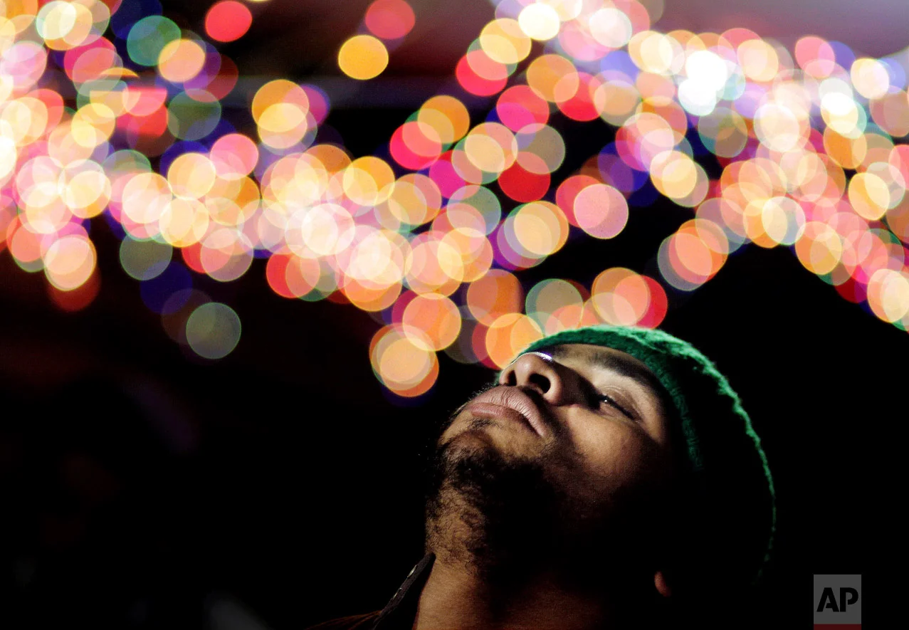 In this Wednesday, March 16, 2016 photo, a Muslim man performs Zikr, or remembrance of god, as he celebrates a Moulid, which commemorates the birth of Sayeda Nafisa, a descendant of the Prophet Muhammad through his grandson Hasan, in front of the mosque named after her, in Cairo, Egypt. (AP Photo/Amr Nabil)