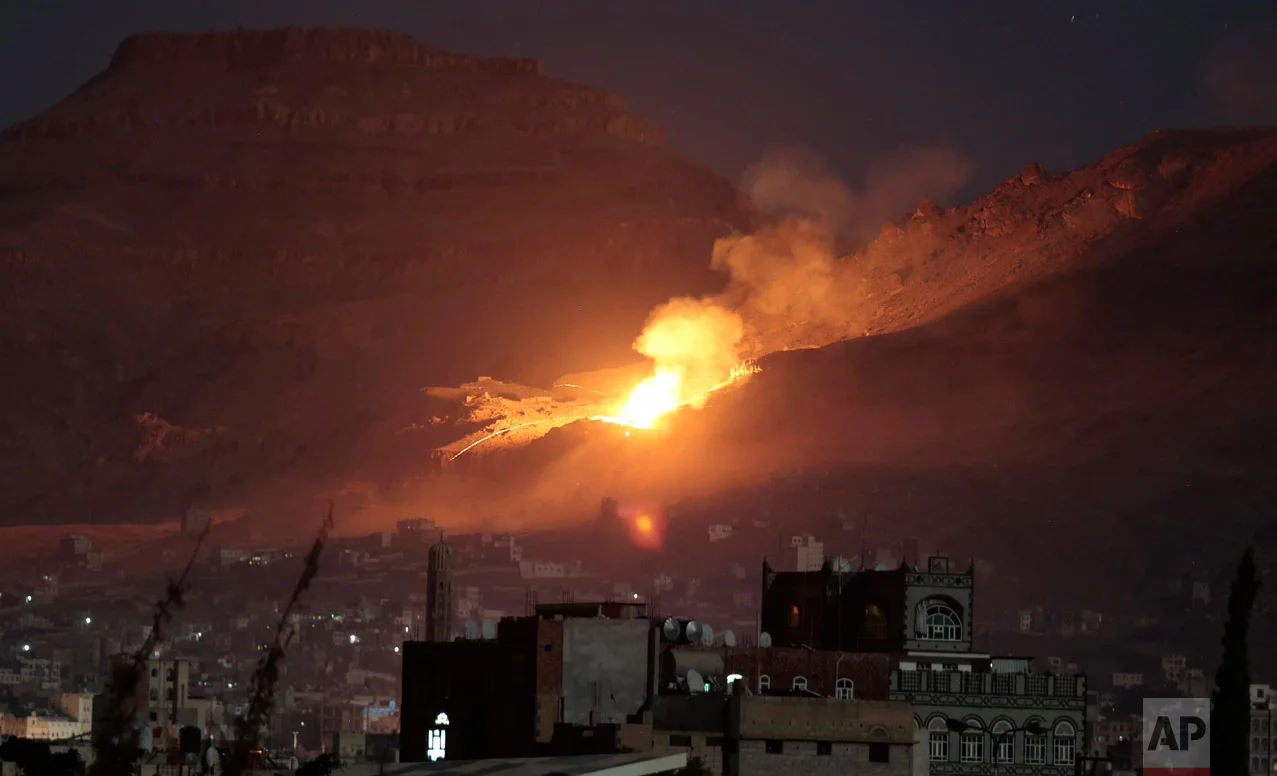 Fire and smoke rise after a Saudi-led airstrike hit a site believed to be one of the largest weapons depots on the outskirts of Yemen's capital, Sanaa, Friday, Oct. 14, 2016. (AP Photo/Hani Mohammed)