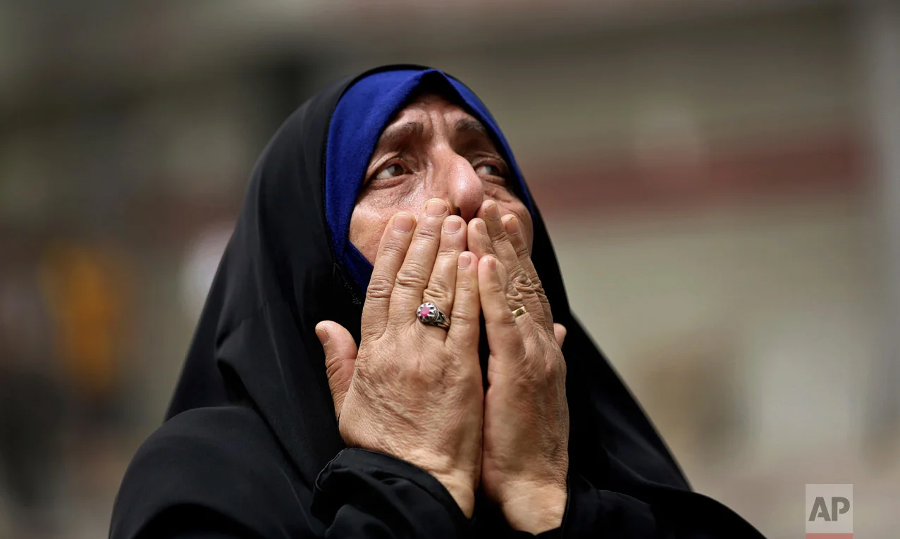 An Iraqi woman grieves at the scene after a truck bomb attack in Karradah, a busy shopping district in the center of Baghdad, Iraq on July 3, 2016. (AP Photo/Hadi Mizban)