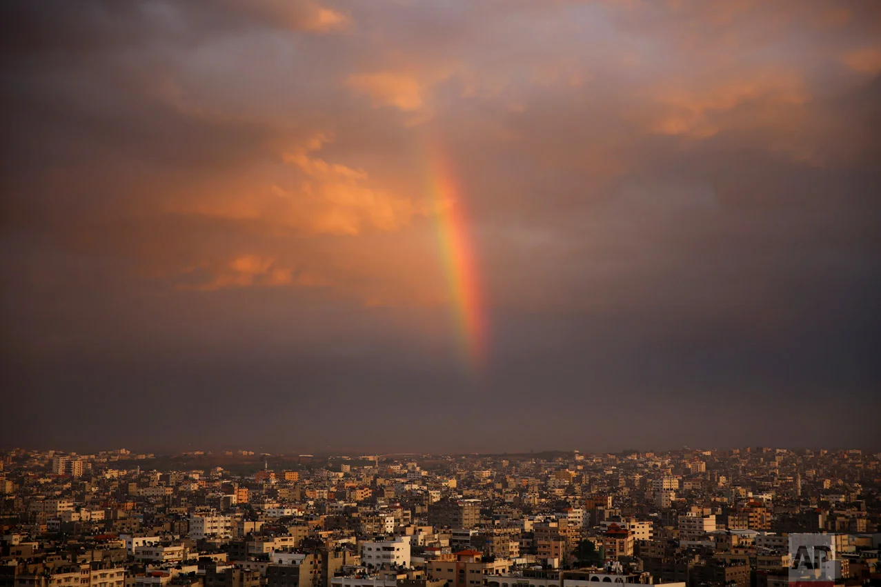 A rainbow shines in the sky above the city following a rainstorm, in Beit Lahiya City, Gaza Strip, Thursday, Dec. 8, 2016. (AP Photo/Adel Hana)