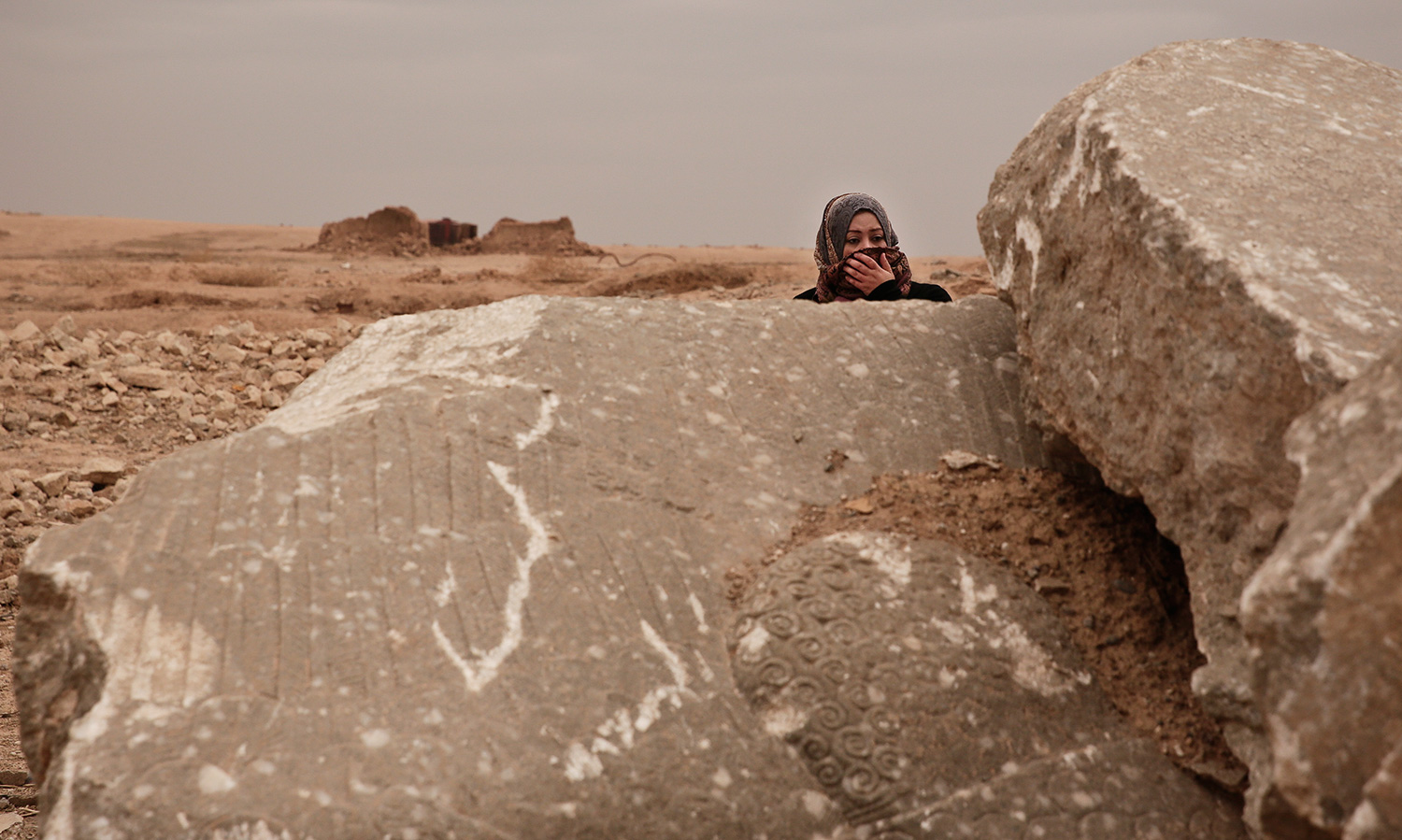 Turning Iraq history to rubble, leaving the mess to looters — AP Photos