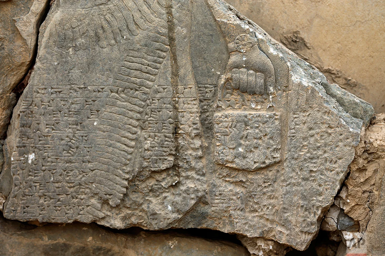 This Wednesday, Nov. 16, 2016 photo shows a part of carved stone slabs which were destroyed by Islamic State group militants, at the ancient site of Nimrud some 19 miles (30 kilometers) southeast of Mosul, Iraq. One of the Mideast’s most important archaeological sites, the nearly 3,000-year-old remains of an Assyrian capital had been a trove of ancient Mesopotamian art and, with hundreds of clay tablets, provided archaeologists a wealth of information on the era. (AP Photo/Hussein Malla)