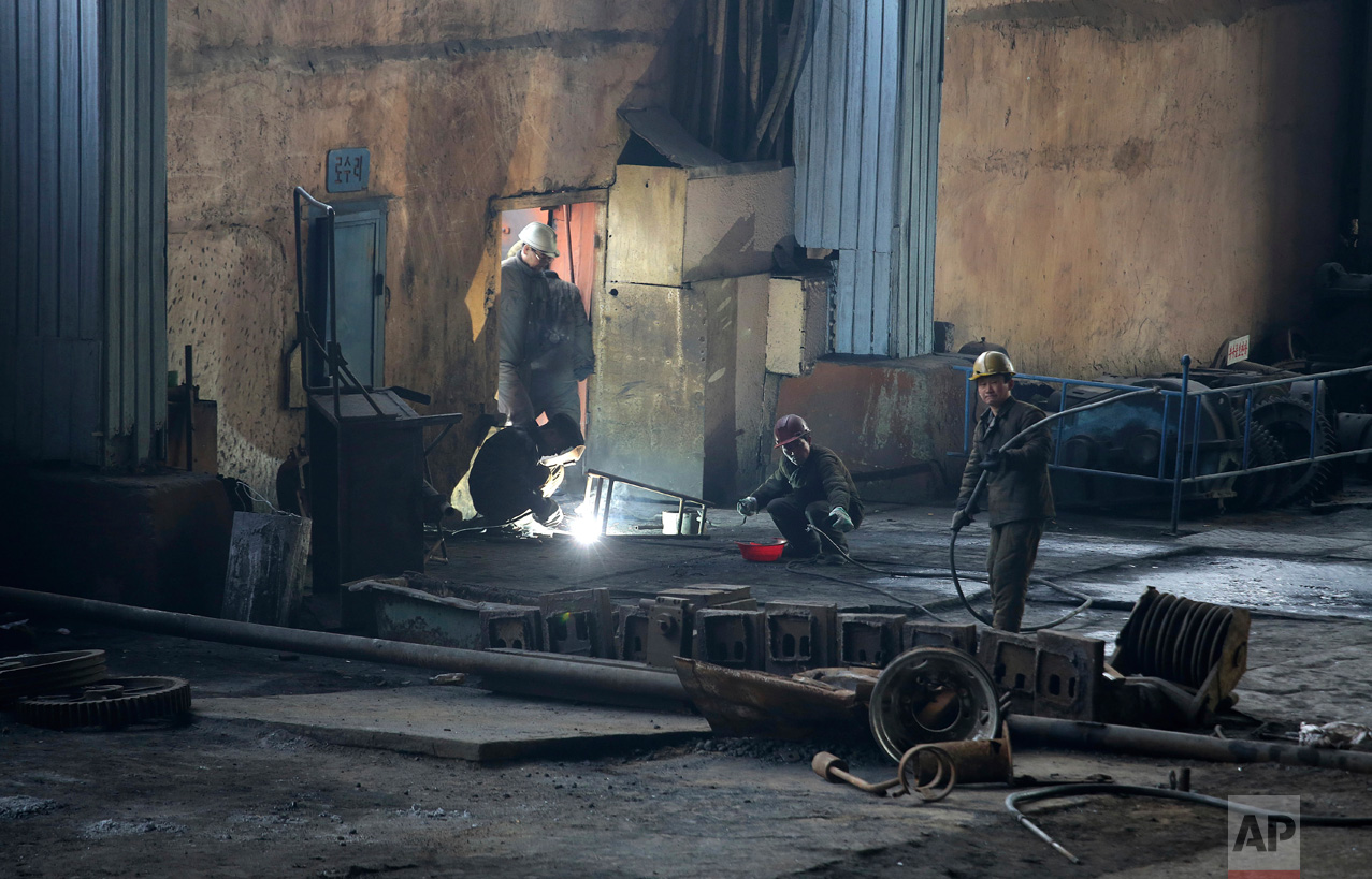 In this Saturday, Jan. 7, 2017 photo, North Korean men work at the Chollima Steel Complex in Nampo, North Korea. North Korean officials and factory managers are scrambling to answer a call from leader Kim Jong Un for an all-out, nationwide effort to build up the country’s economy in 2017. The sprawling Chollima complex south of Pyongyang, the capital, is a focal point of North Korea’s effort to expand the economy and lift the nation’s standard of living. One of seven North Korean steel works, Chollima has more than 8,000 workers and is among the North’s showcase enterprises. (AP Photo/Wong Maye-E)