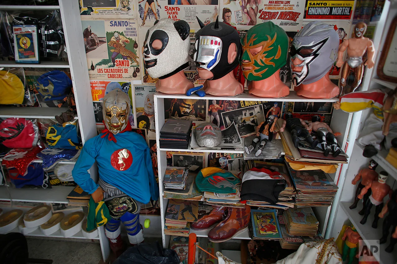 In this Jan. 11, 2017 photo, Mexican "lucha libre" wrestling masks and other paraphernalia are displayed in the Lucha Libre room of the Mexico Antique Toy Museum in Mexico City. The museum is having to struggle following a congressional decision to stop allocating cultural funds for the collection. The museum has had to cut staff by half and most of its cultural events and workshops have been suspended, says the son, who hopes to raise money for the museum through a Kickstarter campaign.(AP Photo/Dario Lopez-Mills)
