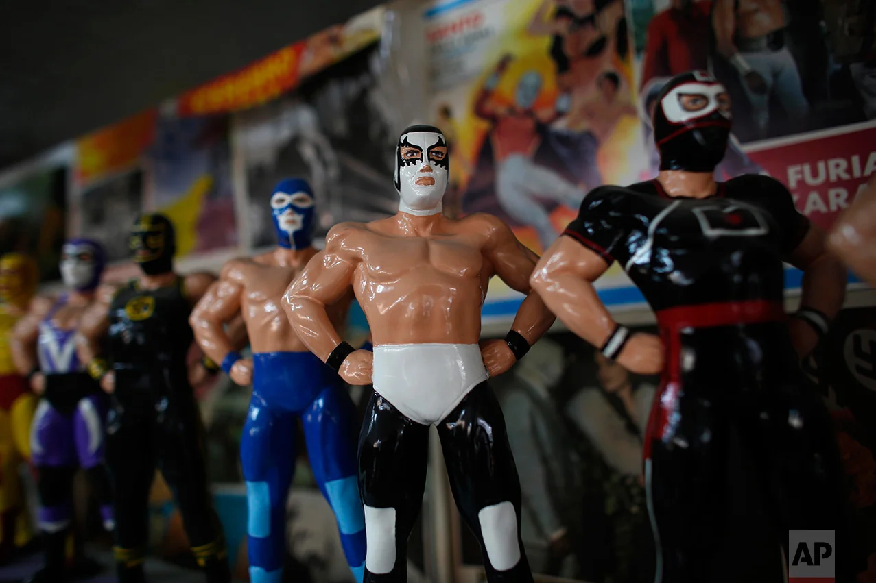 In this Jan. 11, 2017 photo, Mexican "lucha libre" wrestling dolls are displayed in the Lucha Libre room of the Mexico Antique Toy Museum in Mexico City. The museum is struggling, following a congressional decision to stop allocating cultural funds for the collection. The museum has had to cut staff by half and most of its cultural events and workshops have been suspended, but it hopes to raise money through a Kickstarter campaign. (AP Photo/Dario Lopez-Mills)