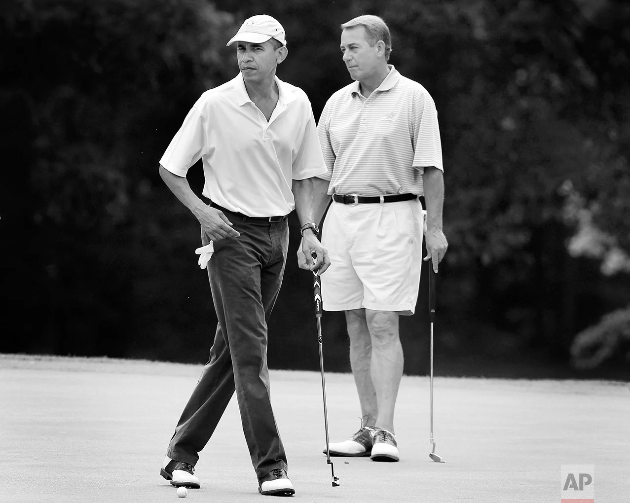 President Barack Obama and House Speaker John Boehner, R-Ohio, are on the first hole as they play golf at Andrews Air Force Base, Md., Saturday, June 18, 2011. (AP Photo/Charles Dharapak)