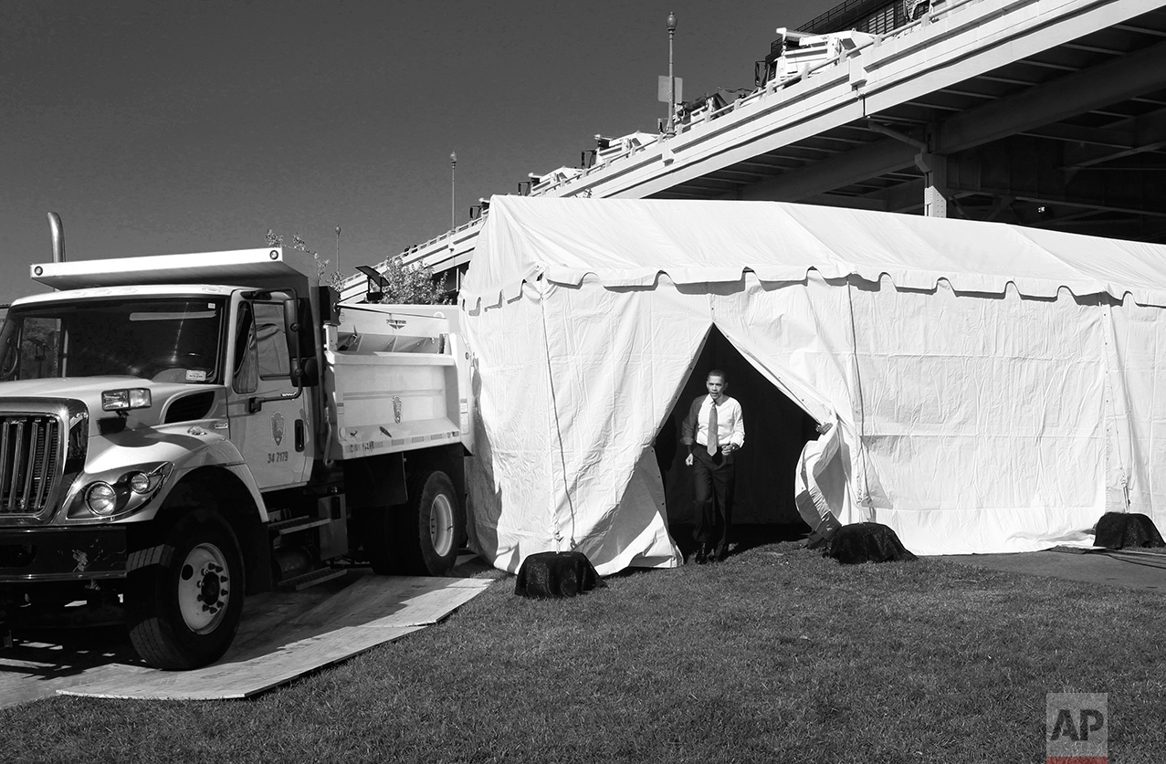 President Barack Obama emerges from a holding tent before speaking about jobs, Wednesday, Nov. 2, 2011, at Georgetown Waterfront Park in Washington. Obama is urging Congress to pass the infrastructure piece of the American Jobs Act. (AP Photo/Charles Dharapak)
