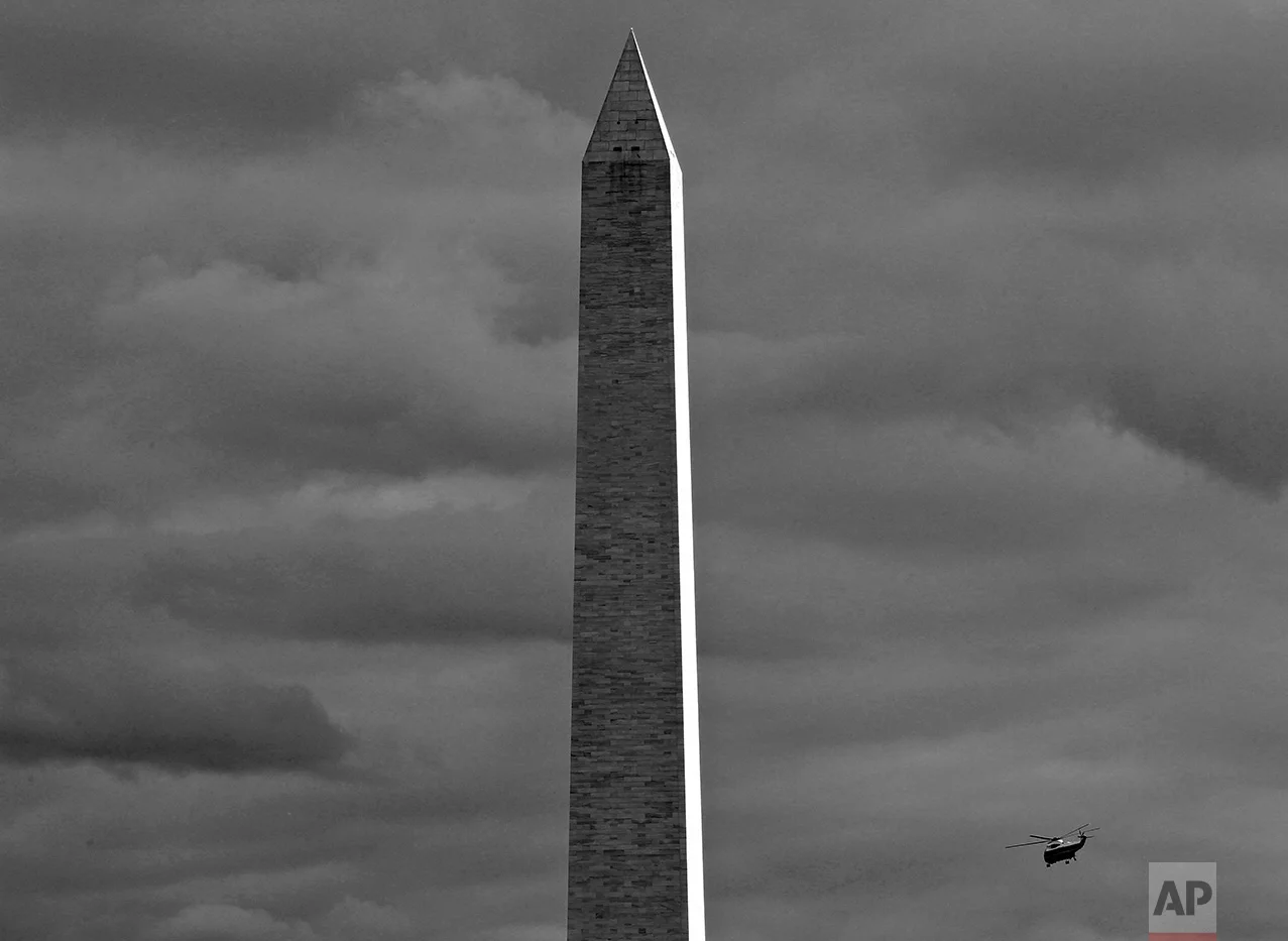 Marine One helicopter with President Barack Obama on board flies past the Washington Monument en route to Andrews Air Force Base as he travels to Newark, N.J., Wednesday, Oct. 6, 2010. (AP Photo/Charles Dharapak)