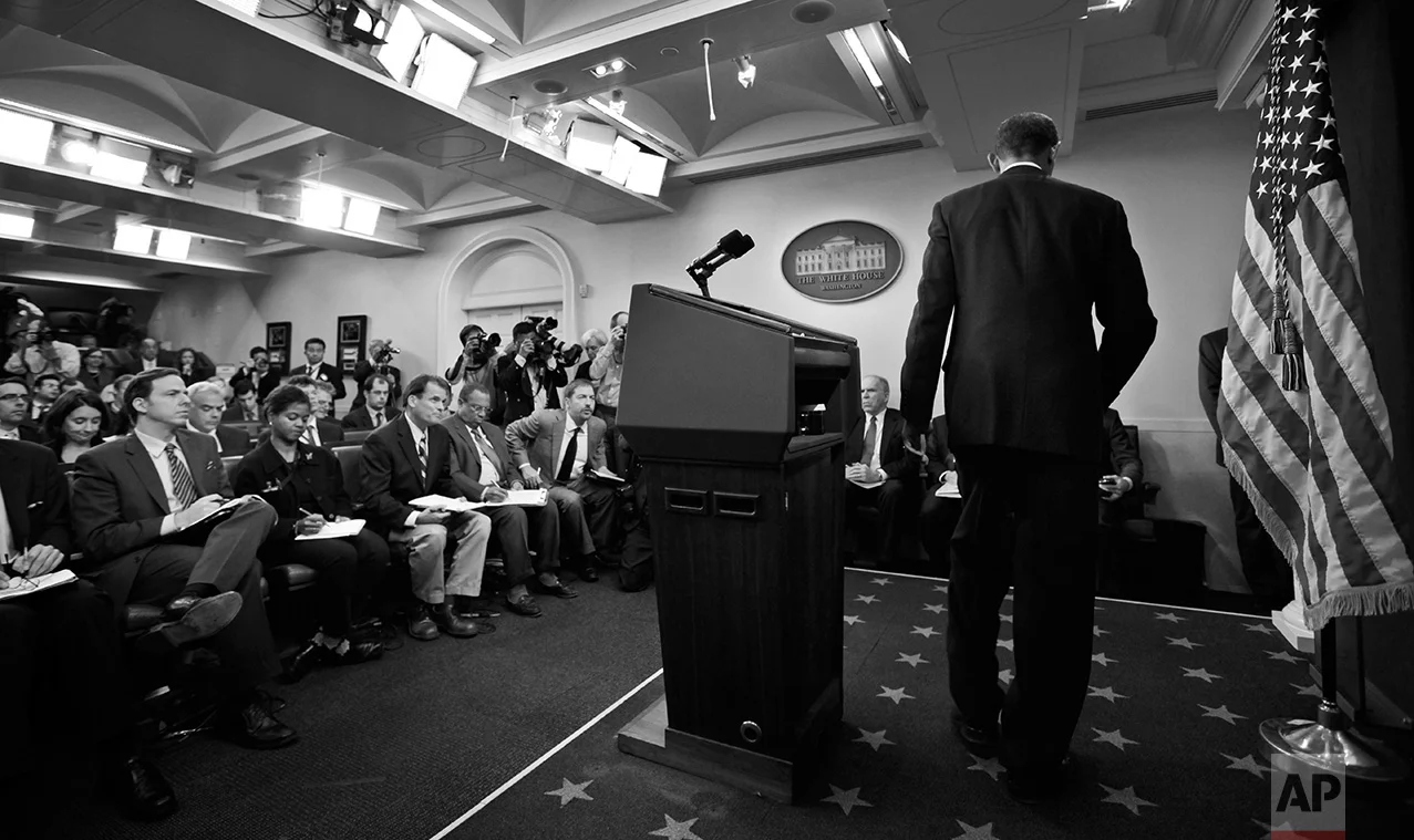 President Barack Obama leaves the podium after making a statement to reporters about the suspicious packages found on U.S. bound planes in the James Brady Press Briefing Room at the White House in Washington, Friday, Oct. 29, 2010. (AP Photo/Charles Dharapak)