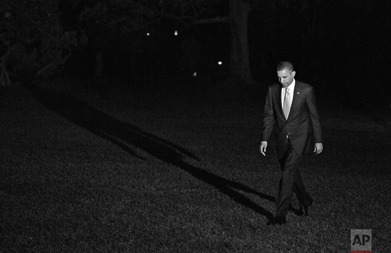 President Barack Obama walks on the South Lawn of the White House in Washington as he returns from a campaign event in Miami, Monday, Oct. 11, 2010. (AP Photo/Charles Dharapak)