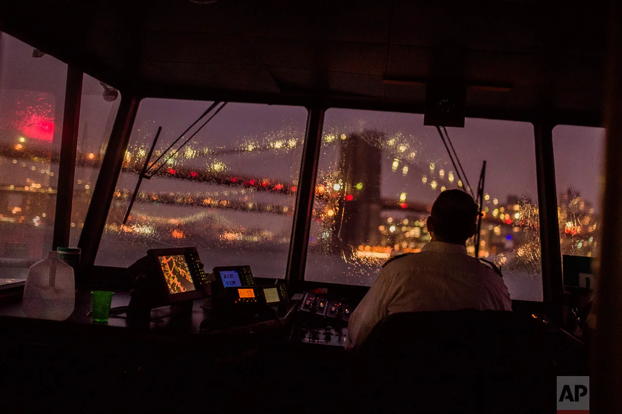 A ferry travels on the East River from Manhattan to Brooklyn during a storm in New York, Monday, Jan. 23, 2017. From California to the Deep South to the Northeast, millions of Americans dealt with death and destruction from a series of storms. (AP Photo/Andres Kudacki)