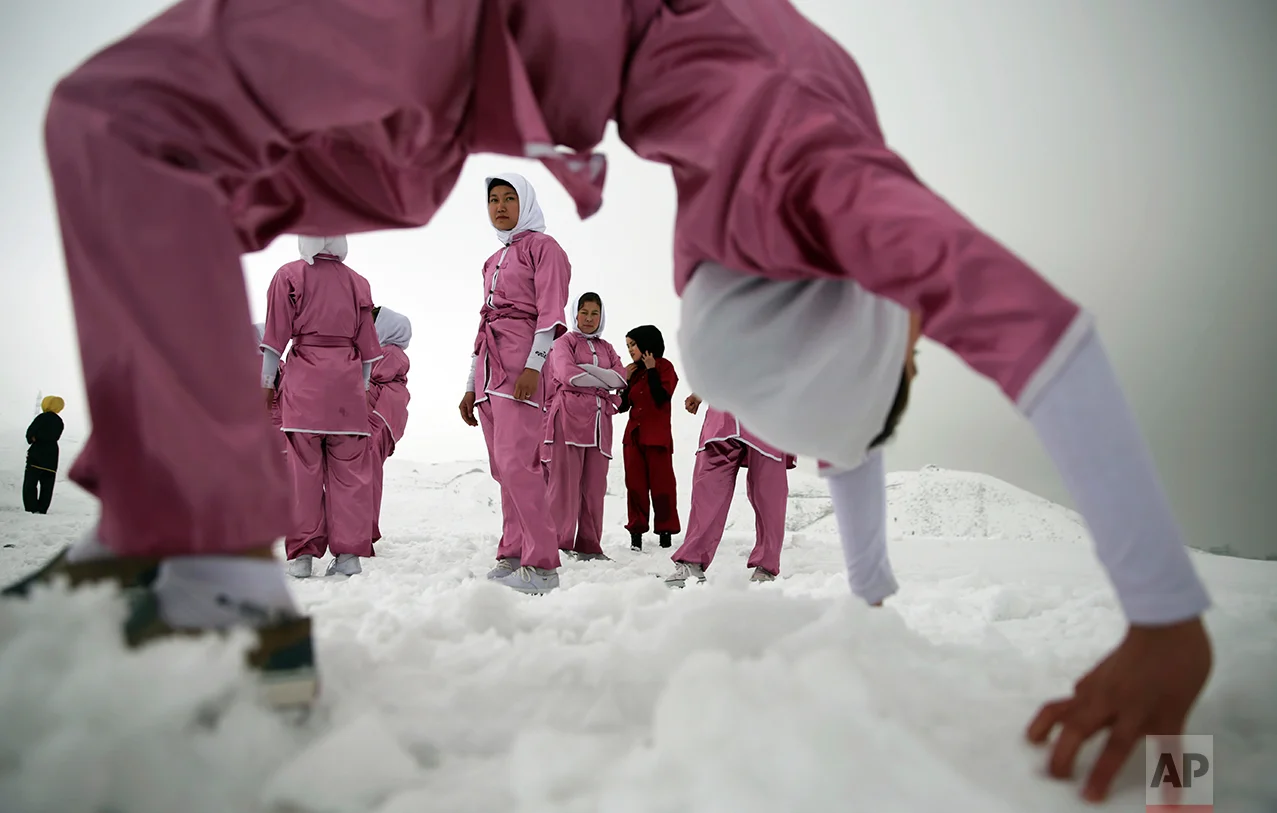 Shaolin martial arts students practice on a hilltop in the snow, in Kabul, Afghanistan, Tuesday, Jan. 25, 2017. The ten ethnic Hazara women are preparing for the day that Afghanistan can send its women’s team to the Shaolin world championship in China. (AP Photos/Massoud Hossaini)