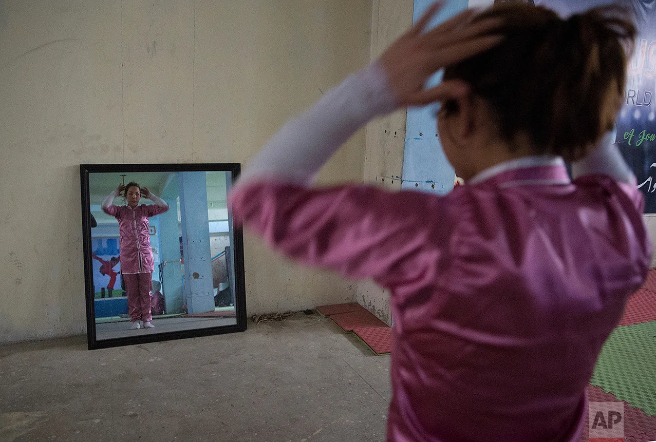 A Shaolin martial arts student prepares to practice at her club in Kabul, Afghanistan, Tuesday, Jan. 25, 2017. At first the women could not find Shaolin uniforms, but, undeterred, they designed and ordered uniforms made by a Kabul tailor. (AP Photos/Massoud Hossaini)