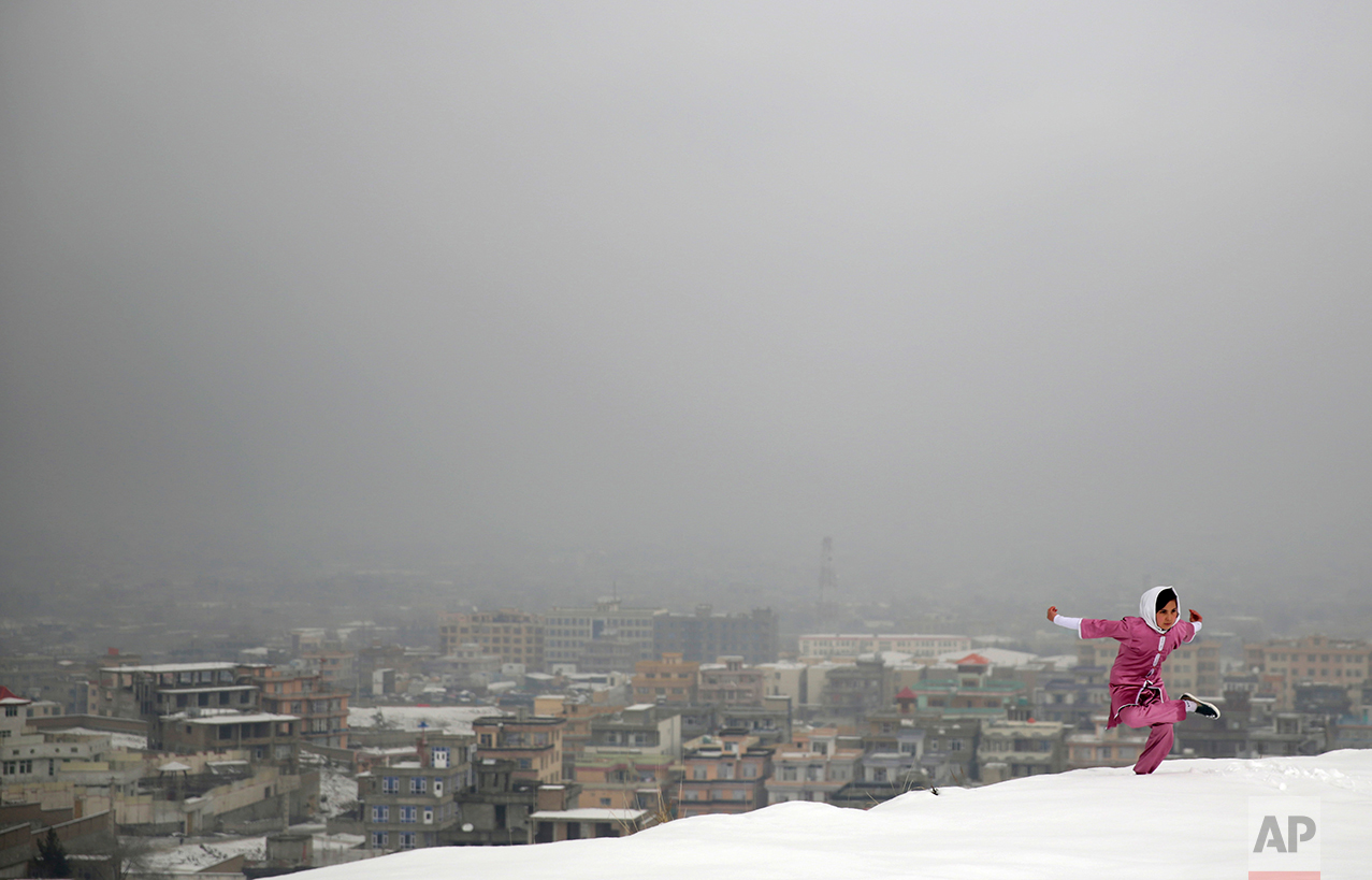 A Shaolin Wushu martial arts student practices on a hilltop in Kabul, Afghanistan, Tuesday, Jan. 25, 2017, preparing for the day that Afghanistan can send its women’s team to the Shaolin world championship in China.(AP Photos/Massoud Hossaini)