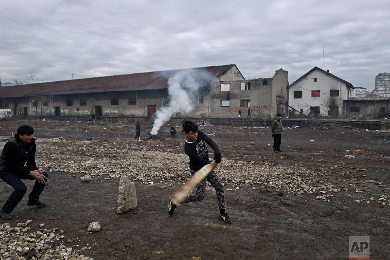  Migrants play cricket outside an abandoned warehouse where they are taking refuge in Belgrade, Serbia, Thursday, Feb. 2, 2017. (AP Photo/Muhammed Muheisen) 