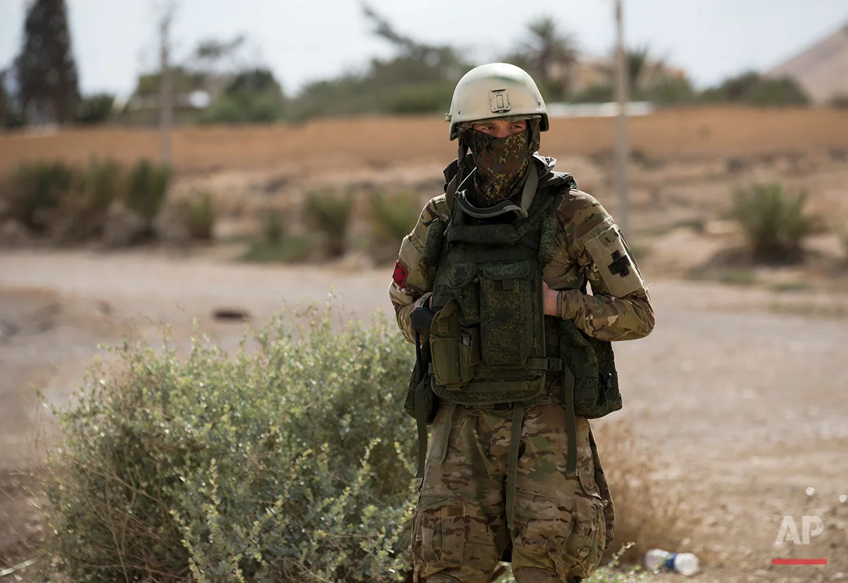 A Russian soldier stands guard in the ancient city of Palmyra in the central Homs province, Syria, Thursday, April 14, 2016. Russian combat engineers are in Syria on a mission to clear mines in Palmyra, which has been recaptured from Islamic State militants in an offensive that has proven Russia’s military might in Syria despite a drawdown of its warplanes. (AP Photo/Hassan Ammar)