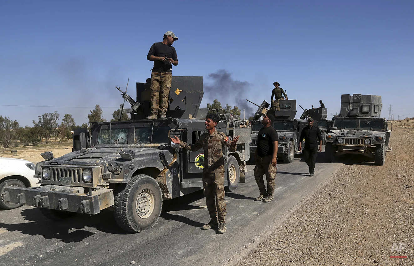 Iraq’s elite counter terrorism forces advance in Hit, 85 miles (140 kilometers) west of Baghdad, Iraq, Monday, April 4, 2016. Iraqi forces say they have entered the western Islamic State group-held town of Hit Monday after an operation to retake it …