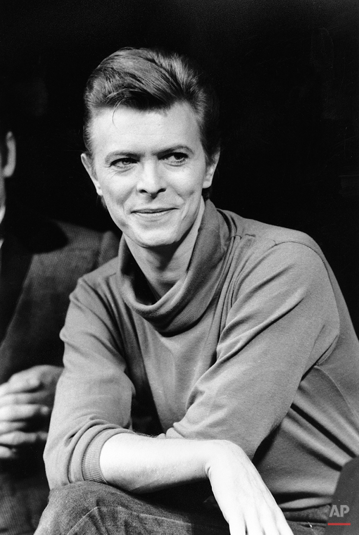 In this Sept. 17, 1980 photo, David Bowie listens during a news conference after a rehearsal at the Booth Theater in New York. Bowie was appearing in the Broadway production of “The Elephant Man.” Bowie, the innovative and iconic singer whose illustrious career lasted five decades, died Monday, Jan. 11, 2016, after battling cancer for 18 months. He was 69. (AP Photo/Marty Lederhandler)