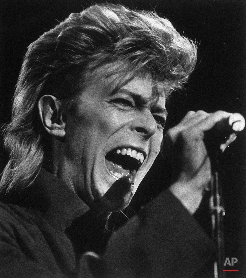 Singer David Bowie performs before an estimated 61,000 fans Sept. 3, 1987 at Sullivan Stadium in Foxboro, Mass. (AP Photo/Elise Amendola)