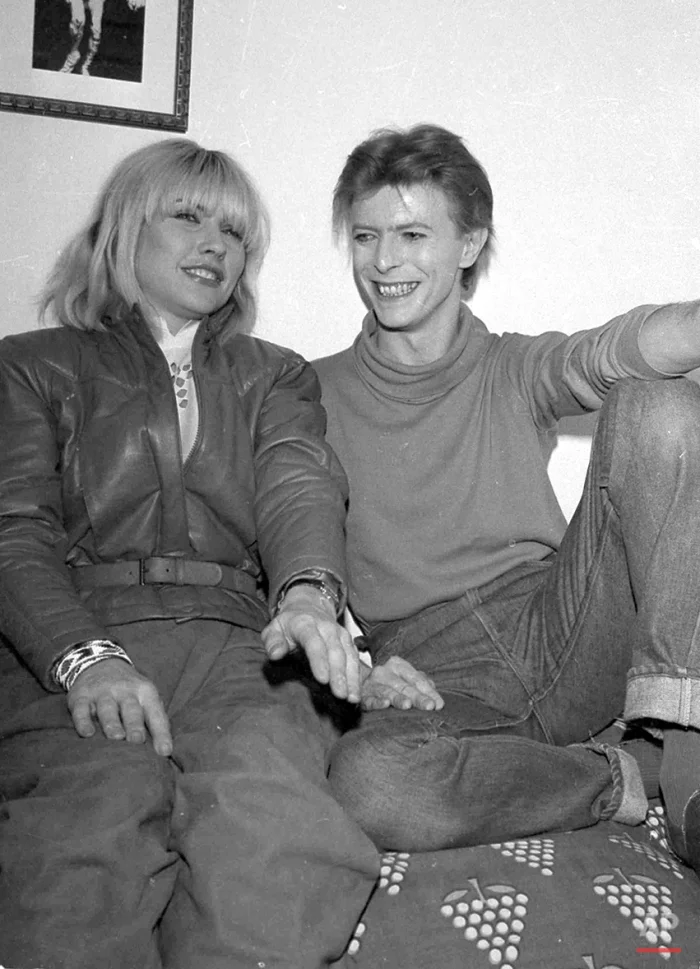 Deborah Harry of the rock band Blondie visits David Bowie backstage at the Booth Theater where he is starring in “The Elephant Man,” Nov. 1980. (AP Photo/Nancy Kaye)