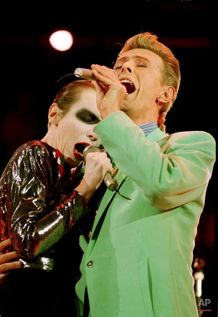 Rock singers David Bowie and Annie Lennox perform a duet at Wembley Stadium in London, April 20, 1992, during a concert in memory of Freddie Mercury, who died last year of AIDS. At least 72,000 fans attended the concert. (AP Photo/Gillian Allen)