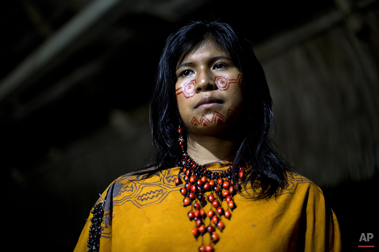  In this June 23, 2015 photo, Yeni Casiano Barboza, 15, from the Ashaninka Indian community, Natividad, poses for a photo while waiting to compete in the annual beauty contest, in the Otari Nativo village, Pichari, Peru. For Ashaninka men, a woman’s 