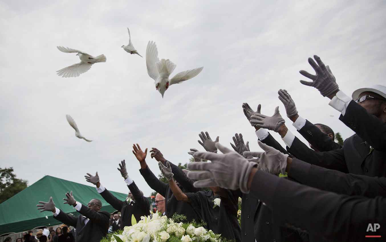 Pallbearers release doves over the casket of Ethel Lance during her burial service, the first one for the nine people killed in the shooting at Emanuel AME Church, Thursday, June 25, 2015, in Charleston, S.C. (AP Photo/David Goldman)