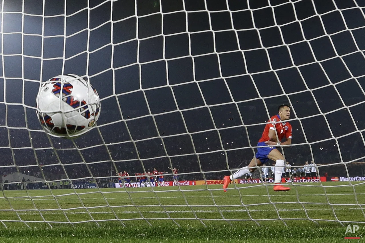 Chile's Alexis Sanchez celebrates after scoring the winning penalty kick against Argentina during the Copa America final soccer match at the National Stadium in Santiago, Chile, Saturday, July 4, 2015. Chile became Copa America champions for the fir