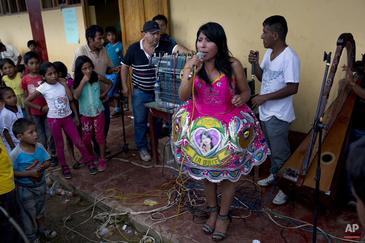  In this March 15, 2015 photo, Nanda la Dulce performs Huayno music during a soccer tournament between villages, in La Mar, province of Ayacucho, Peru. (AP Photo/Rodrigo Abd) 