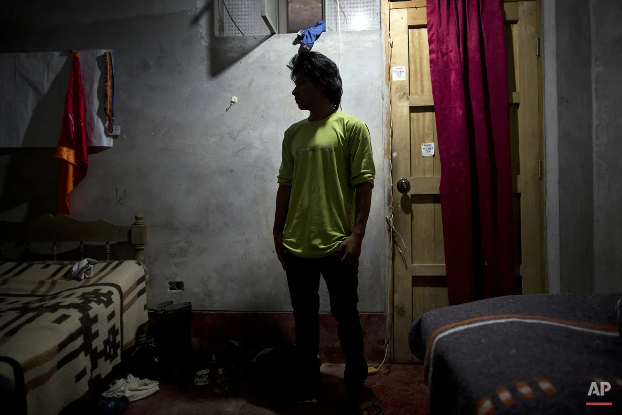  In this March 14, 2015 photo, Mardonio Borda, 19, poses a picture during an interview with The Associated Press, in La Mar, province of Ayacucho, Peru.  A native Quechua with broken Spanish and a sixth-grade education, Borda is among untold hundreds