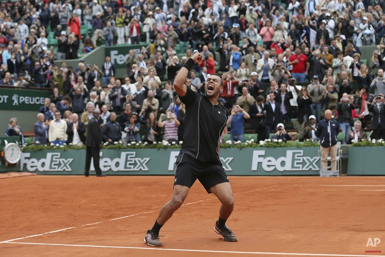  France's Jo-Wilfried Tsonga celebrates wining his fourth round match of the French Open tennis tournament against Tomas Berdych of the Czech Republic in four sets 6-3, 6-2, 6-7, 6-3, at the Roland Garros stadium, in Paris, France, Sunday, May 31, 20