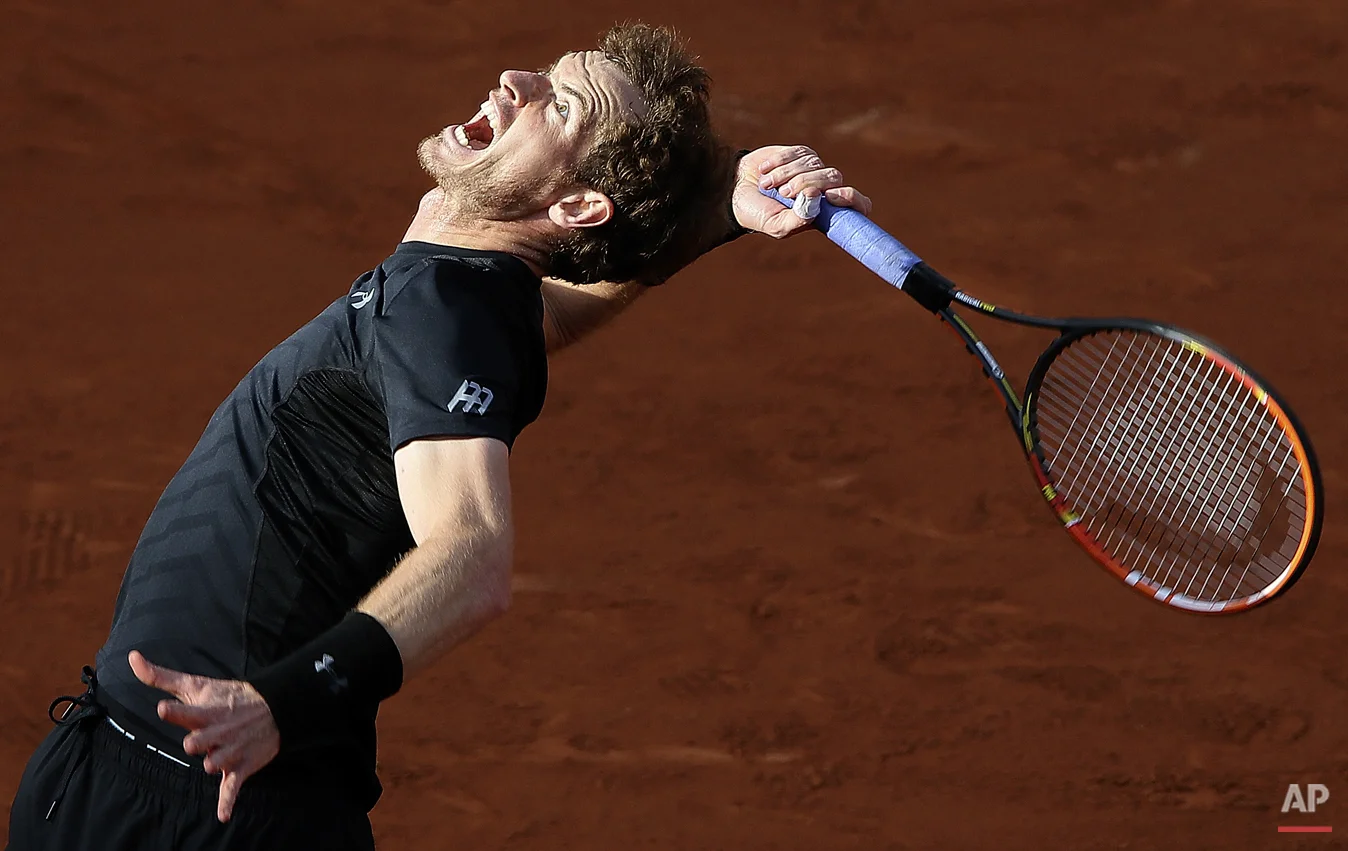  Britain's Andy Murray serves the ball to Argentina's Facundo Arguello during their first round match of the French Open tennis tournament at the Roland Garros stadium, Monday, May 25, 2015 in Paris. Murray won 6-3, 6-3, 6-1. (AP Photo/David Vincent)