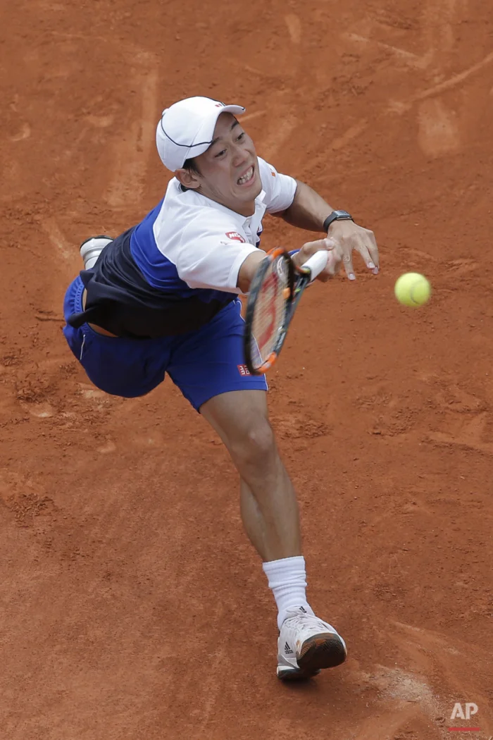 Japan's Kei Nishikori returns in the first round match of the French Open tennis tournament against Paul-Henri Mathieu of France at the Roland Garros stadium, in Paris, France, Sunday, May 24, 2015. (AP Photo/Christophe Ena)